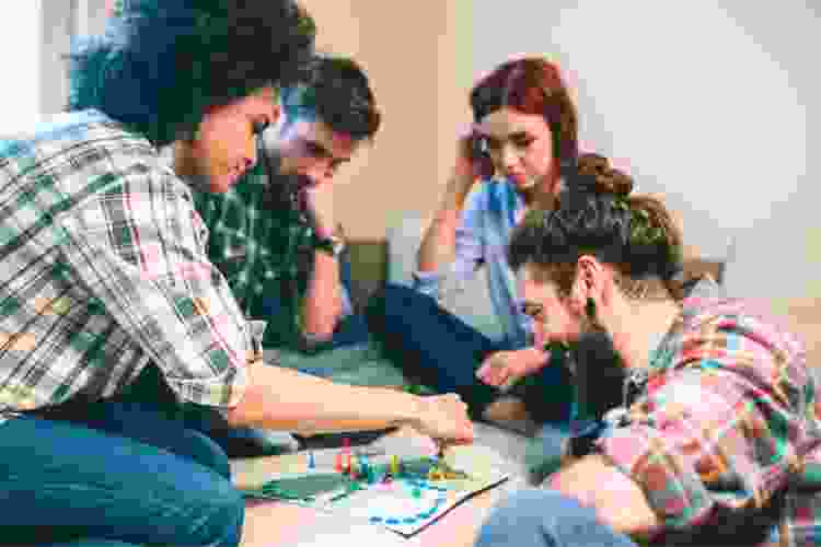 two couples playing board games