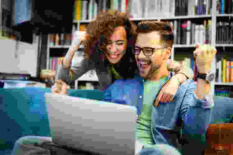 couple playing games online at home