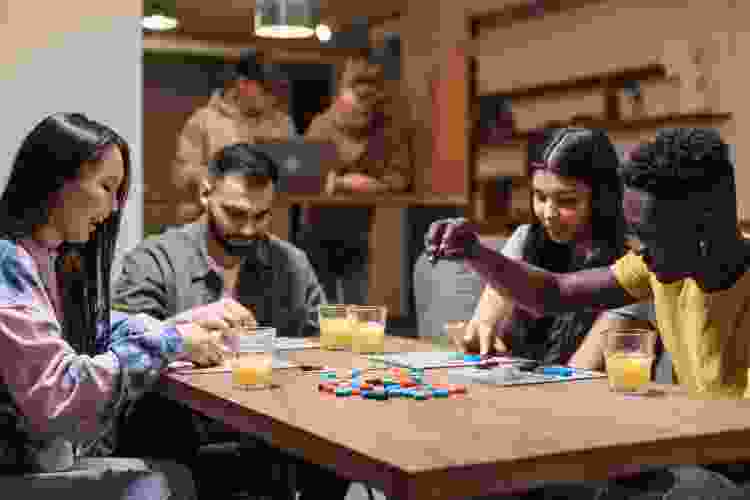 group of friends playing classic board game