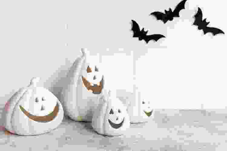 white ghost Jack-o-lanterns with happy smiles