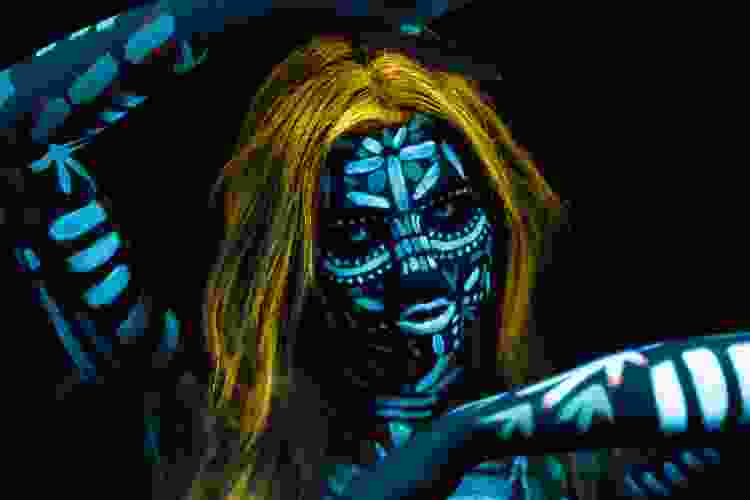 woman wearing Halloween glowing body paint