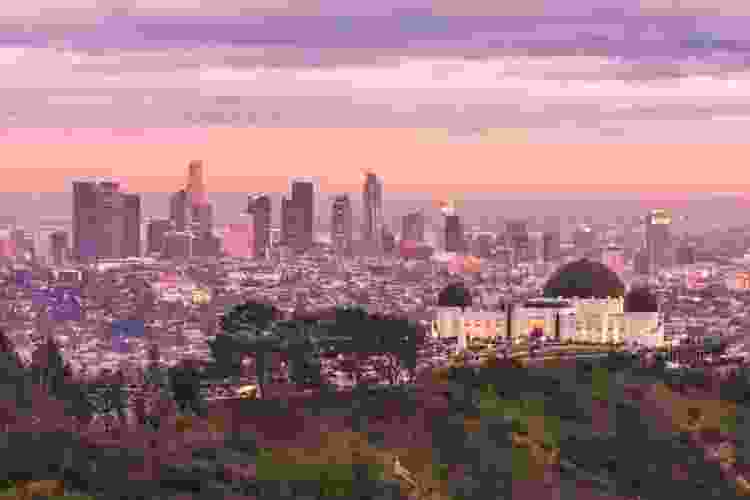 Griffith Observatory at sunset with the LA skyline