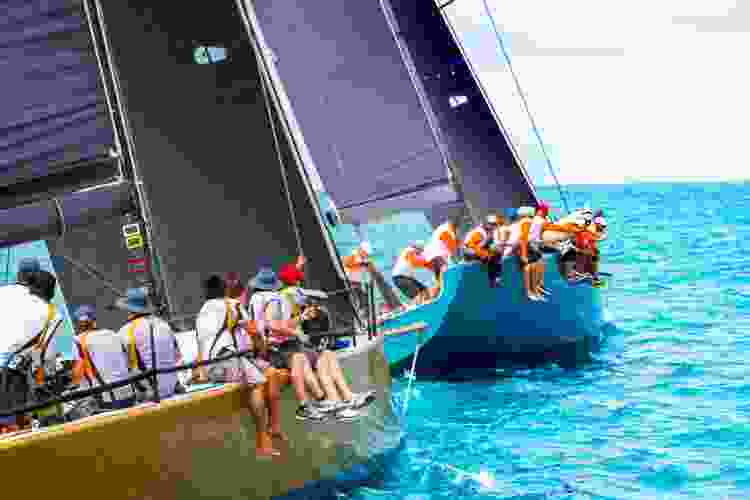 large group of people on a sailboat