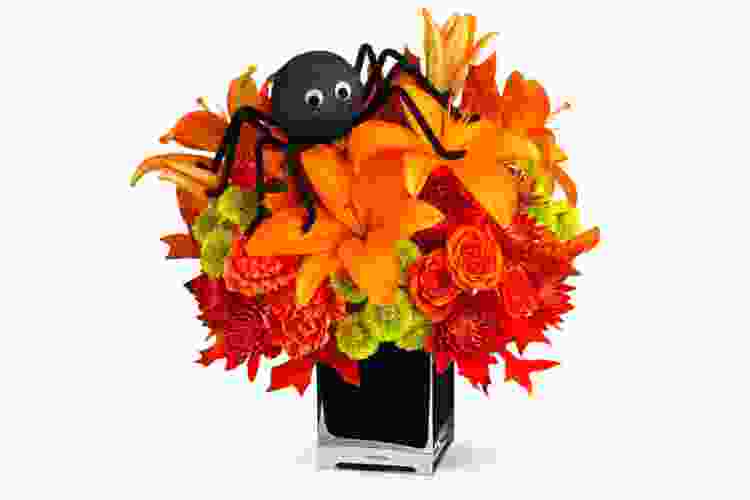 orange Halloween bouquet of flowers with decorative spider on top