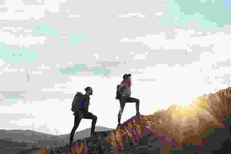 couple hiking in the fall mountains