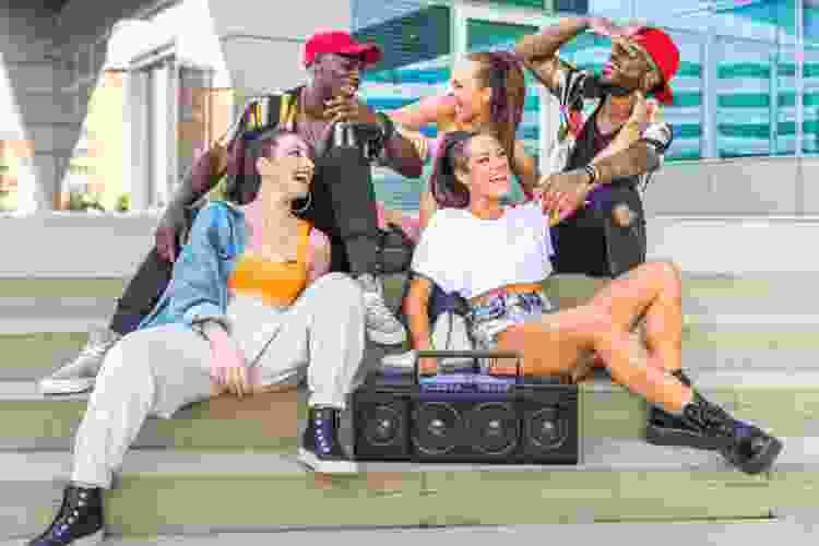 group of friends listening to hip hop boom box