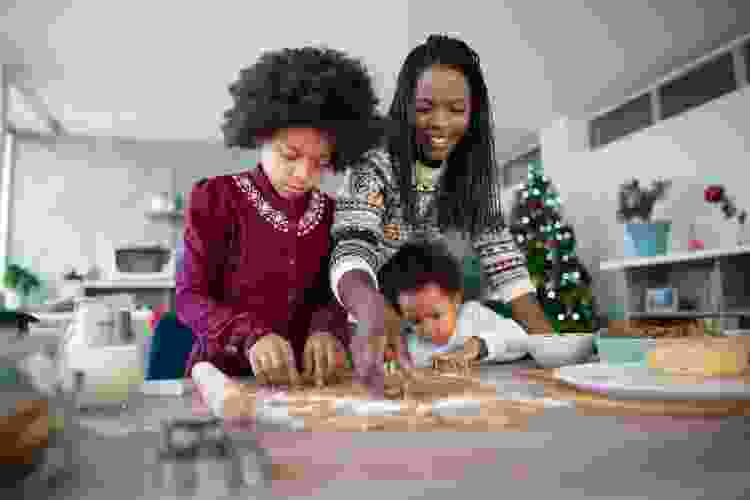 mother baking cookies for a Christmas activity with kids