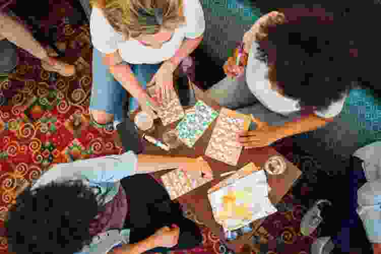 group of friends playing Bingo at home