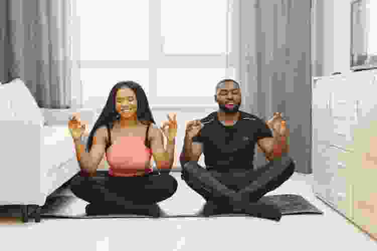 couple doing yoga together at home