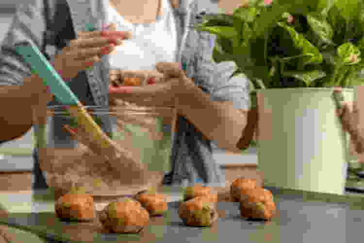 young girl baking cookies at home