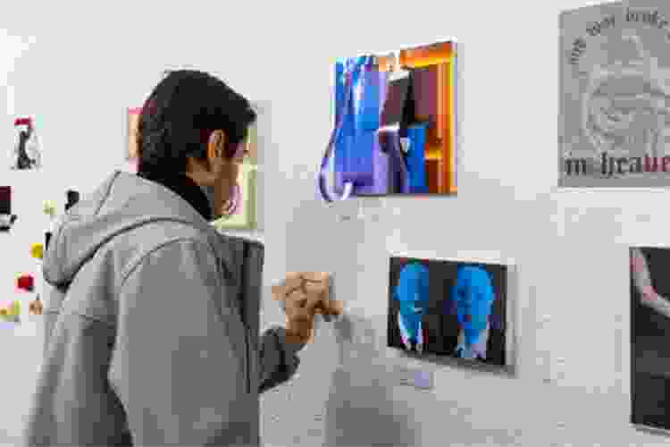 man viewing art in gallery