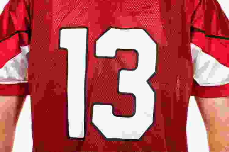 man wearing numner 13 on reed football jersey