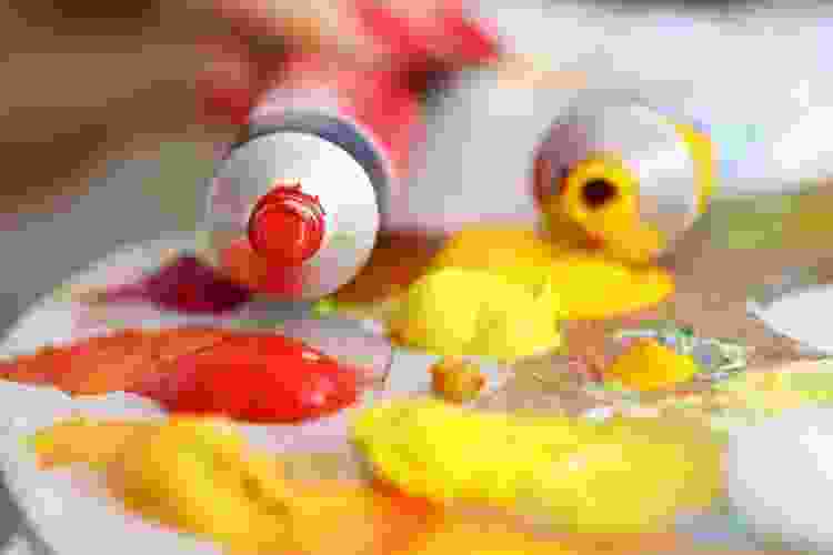 tubes of yellow and red oil paints