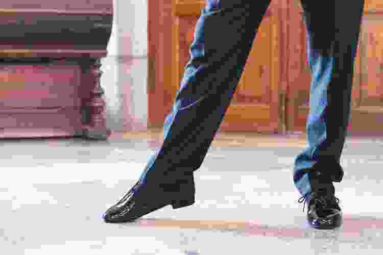 dancer's feet sliding on the dance floor