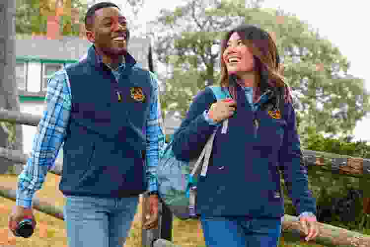 team members wearing matching jackets with team logos