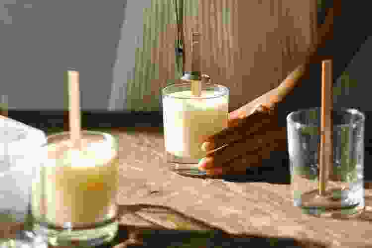 hands holding handmade candle