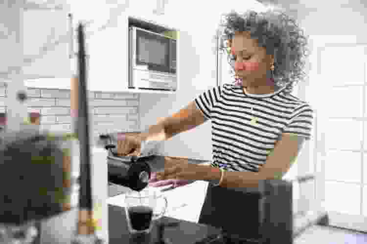 woman making coffee at home