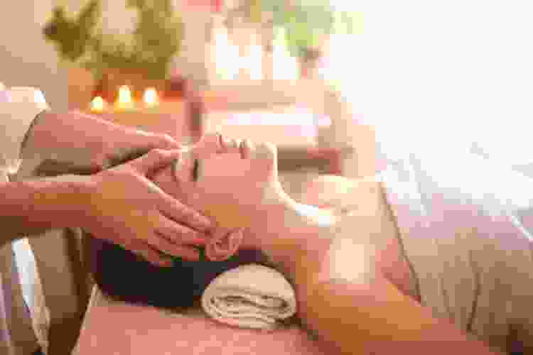 women getting head massage at spa