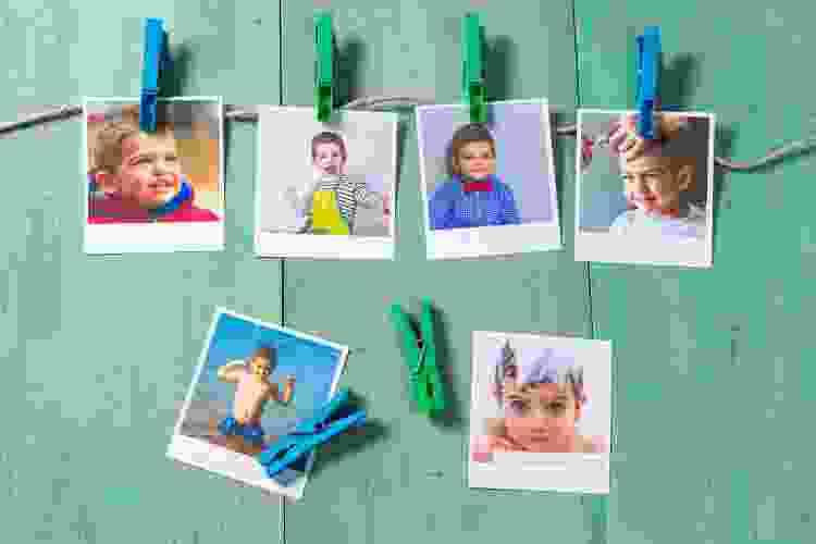 hanging polaroid photos of young boy