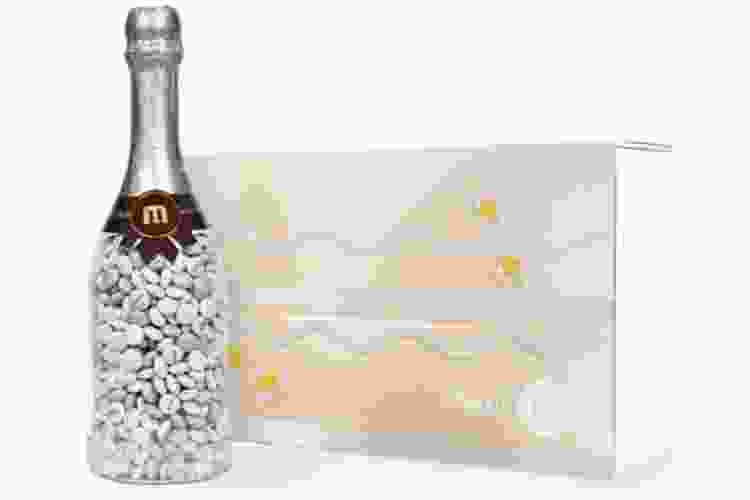 Champagne bottle filled with white wedding m&m candy