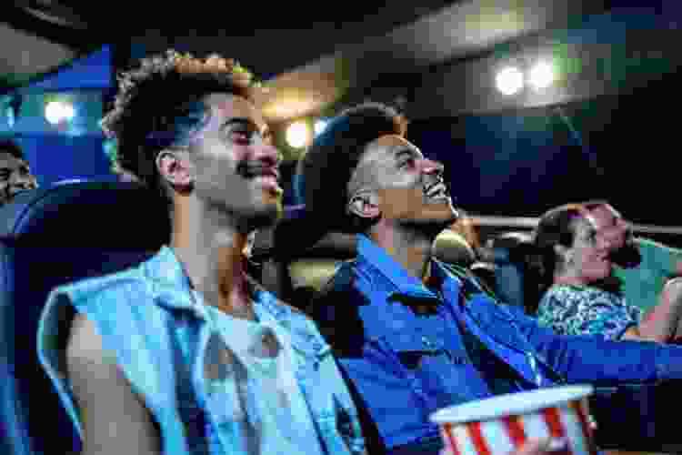 couple laughing in movie theater