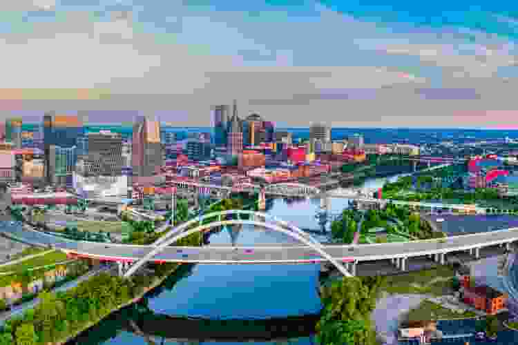 wide view photo of Nashville bridge and cityscape