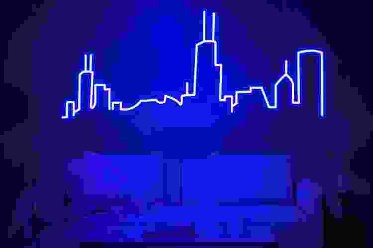 blue neon sign of Chicago skyline