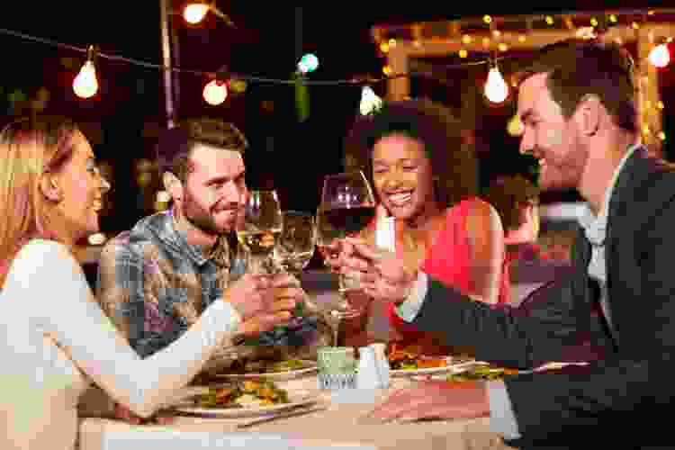 group of friends enjoying dinner outside