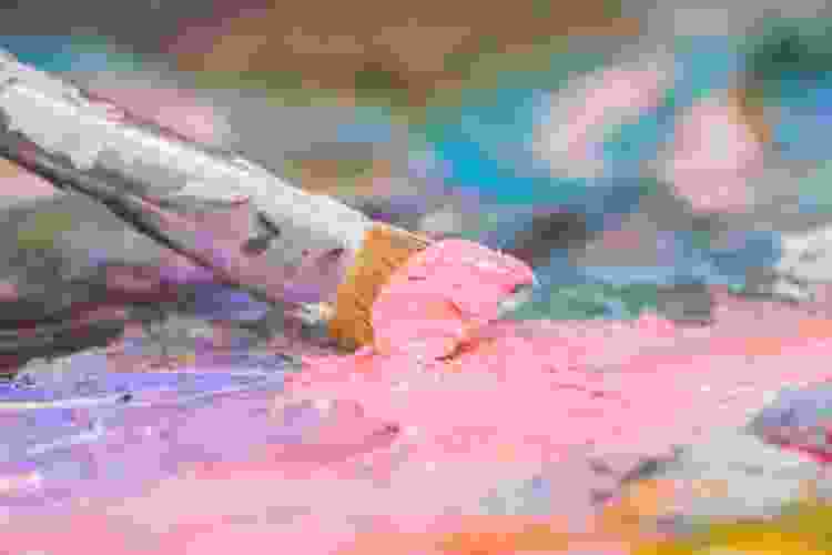 dirty oil paint brush with pink oil paint