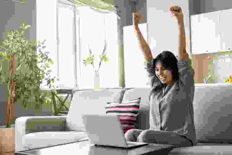 woman celebrating win on online game