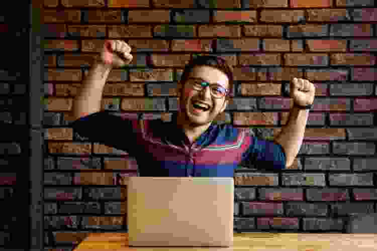 man celebrating online game win