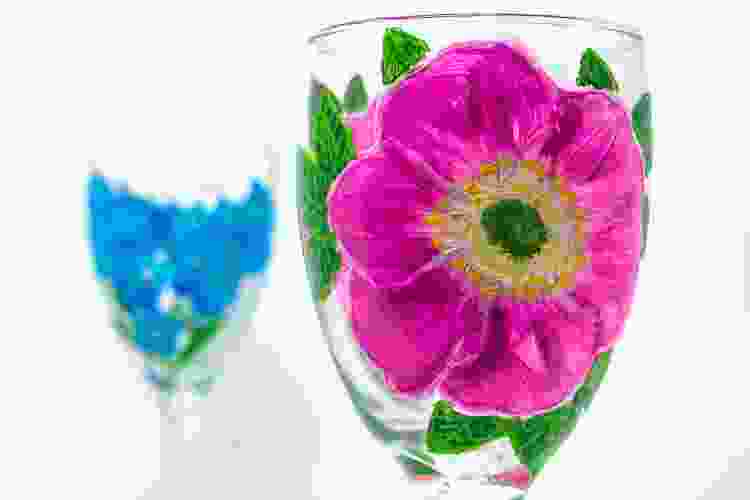 pink flowers painted on wine glass