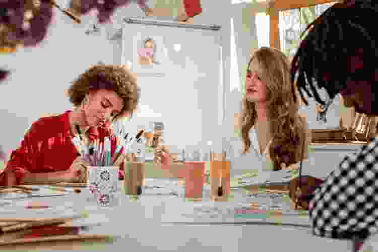 women painting together