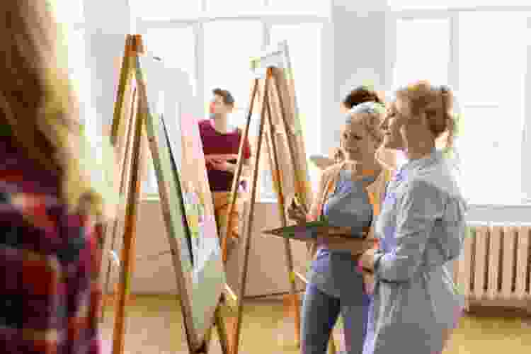 group of adults in painting class