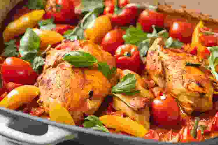 A hearty fall dinner idea is to make Paprika Chicken with Peppers and Tomatoes.