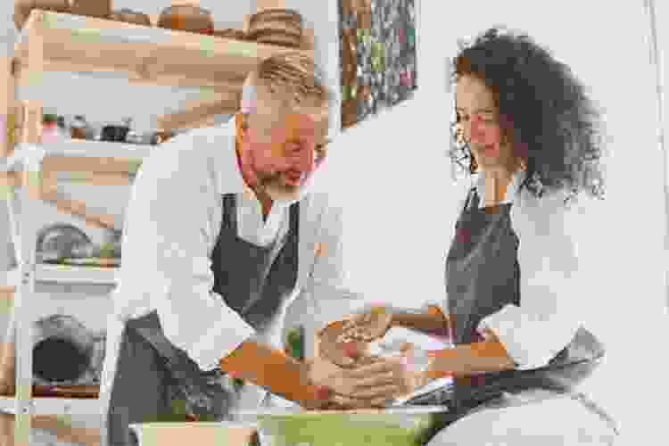 couple molding clay together