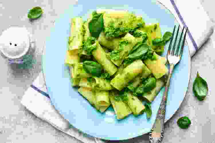 rigatoni noodles in a green pesto sauce