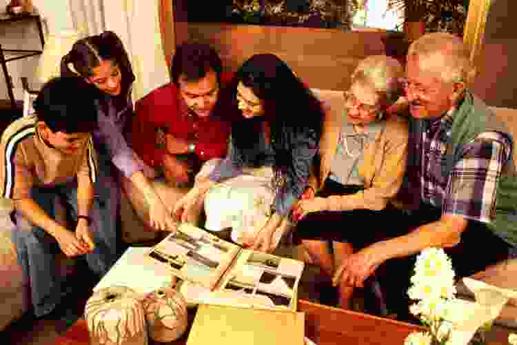 family looking at photo album together