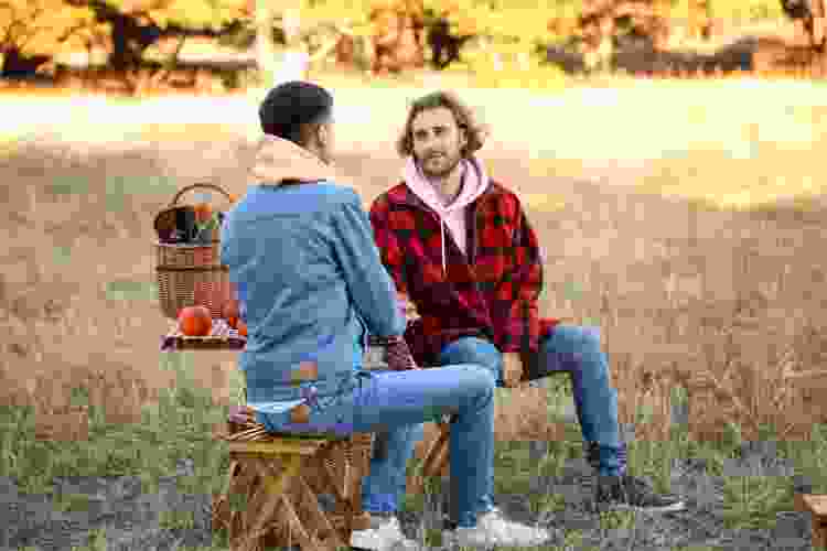 couple enjoying picnic date outdoors