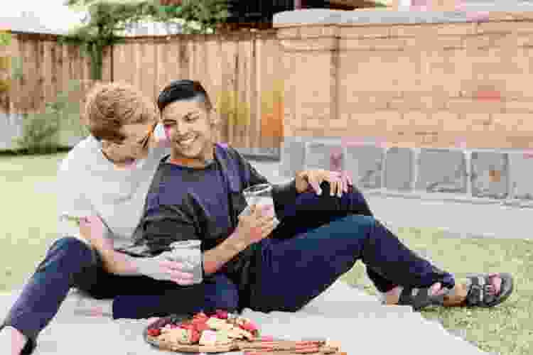 couple enjoying romantic backyard picnic