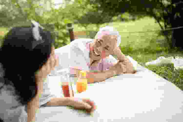 elderly couple having a picnic together