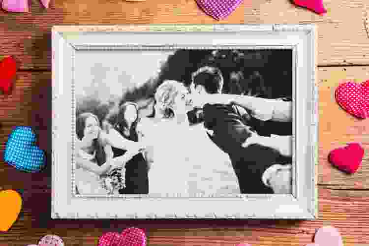 couple's wedding photo in white picture frame