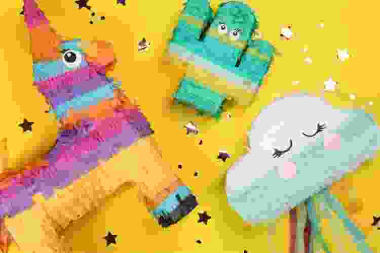 assortment of cute party piñatas and confetti