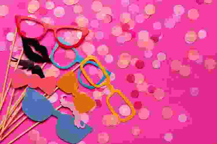 pink photo booth props and confetti