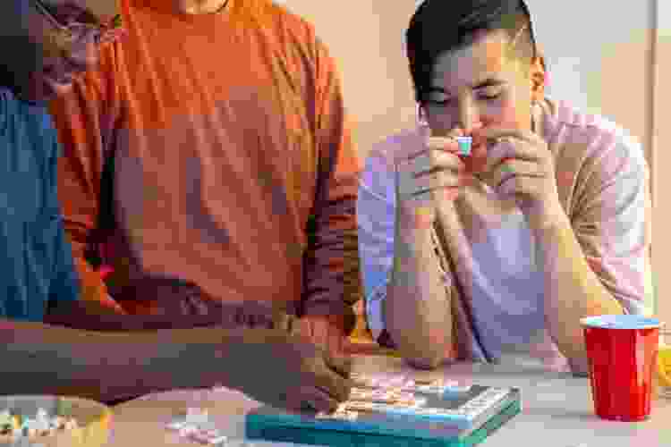 group of friends playing scrabble