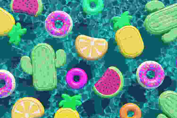 colorful pool floats floating in blue pool