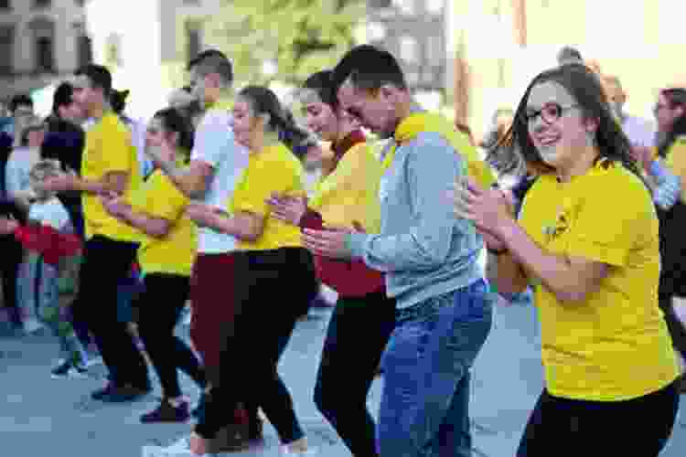 group of line dancers clapping