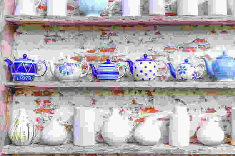 porcelain pots on brick shelf