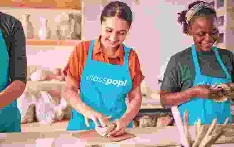 women sculpting clay in pottery classes