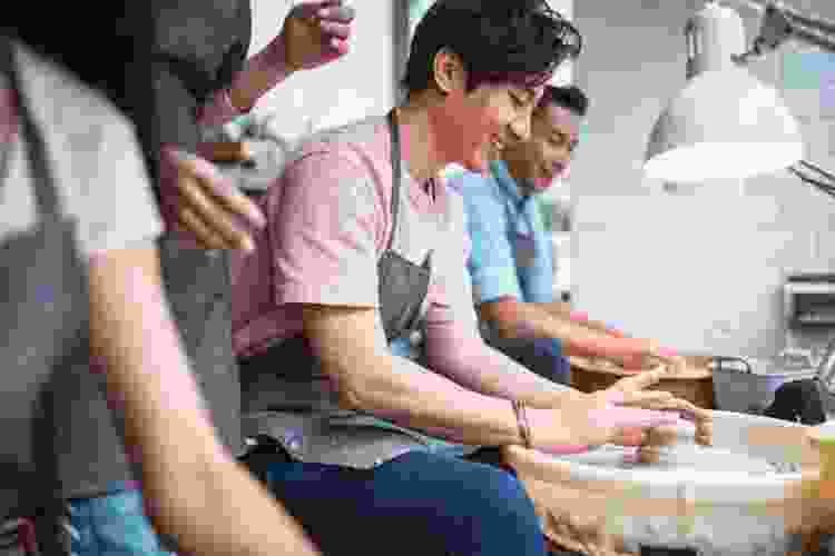 group making pottery in studio